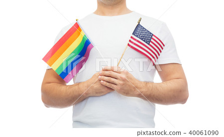 man with gay pride rainbow and american flag 40061090