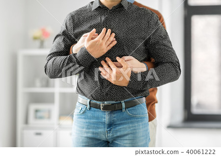 close up of hugging male gay couple 40061222