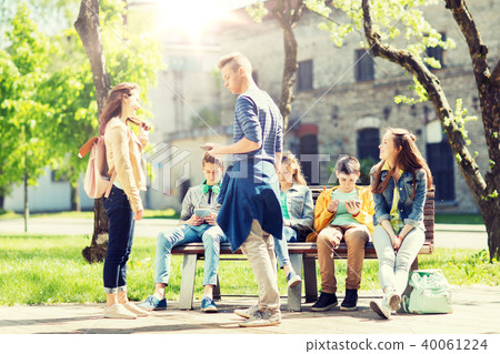 group of teenage students at school yard group of teenage students at school yard 40061224