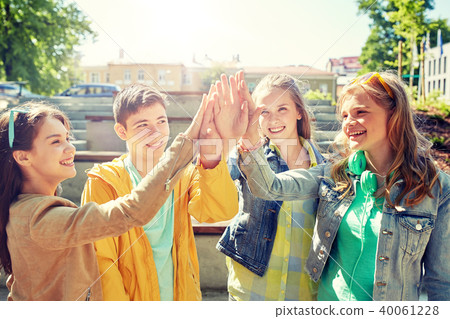 happy students or friends making high five happy students or friends making high five 40061228