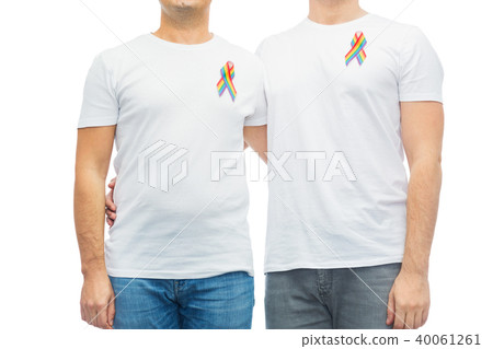 close up of couple with gay pride rainbow ribbons close up of couple with gay pride rainbow ribbons 40061261
