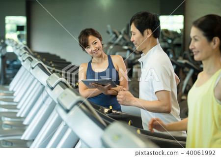 Gym middle couple running machine fitness image 40061992