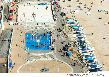 Aerial view of Brighton, people play basketball on court , parking for yachts Aerial view of Brighton, people play basketball on court , parking for yachts 40062579