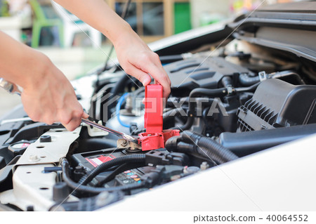 Auto mechanic working at outdoor. Auto mechanic working at outdoor. 40064552