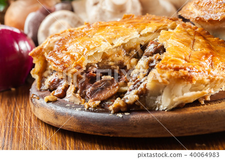 Fresh beef stew pie on a cutting board 40064983