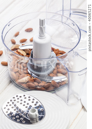 almonds in a food processor ready to be crushed almonds in a food processor ready to be crushed 40065271