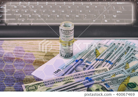 Tax papers in an envelope with 100 dollar bills Tax papers in an envelope with 100 dollar bills 40067469