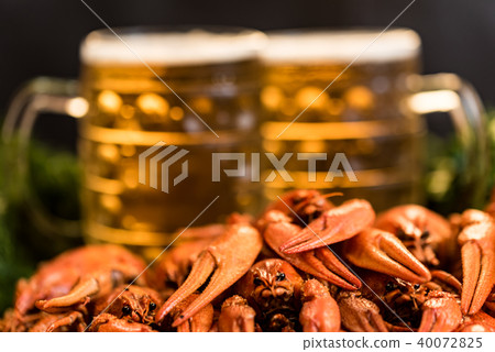 Boiled crayfish with beer on wooden background 40072825
