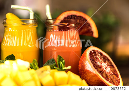 Glasses of juices. Refreshments and summer drinks. Glasses of juices. Refreshments and summer drinks. 40072852