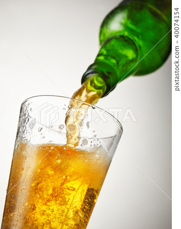 beer is pouring into glass beer is pouring into glass 40074154