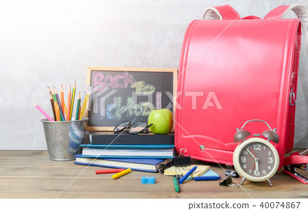 back to school text on black chalk board with bag back to school text on black chalk board with bag 40074867