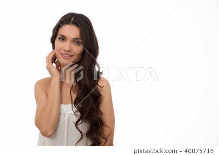 Brunette beauty posing in white studio 40075716