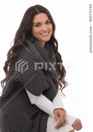 Portrait of brunette woman wearing gray cardigan Portrait of brunette woman wearing gray cardigan 40075749