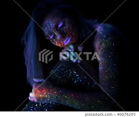 Portrait of Beautiful Fashion Woman in Neon UF Light. Model Girl with Fluorescent Creative Portrait of Beautiful Fashion Woman in Neon UF Light. Model Girl with Fluorescent Creative 40076205