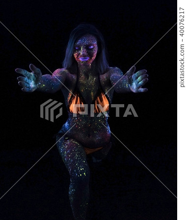 Portrait of Beautiful Fashion Woman Doing Yoga in Neon UF Light. Model Girl with Fluorescent 40076217