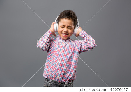 Happy nice boy listening to music Happy nice boy listening to music 40076457