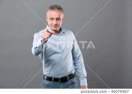 Joyful confident businessman pointing at you 40076987