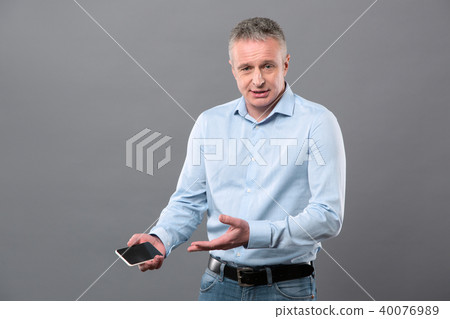 Nice smart man holding his phone 40076989