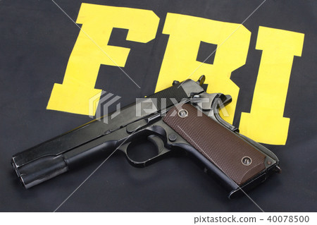 colt government m1911 handgun on fbi uniform 40078500
