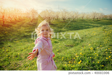 child playing on  sunny spring day. Toning effect. 40081006