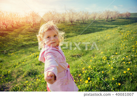 child playing on sunny spring day. Toning effect. child playing on sunny spring day. Toning effect. 40081007