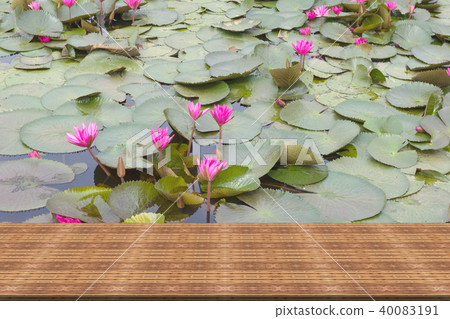 Top desk with pink lotus background,wooden table 40083191