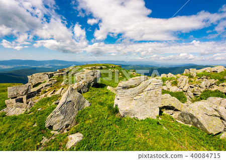 huge boulders on the edge of hillside 40084715