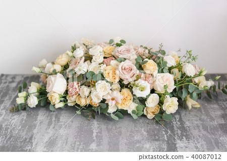 Flower arrangement on gray table. Stylish decor and adorning. 40087012