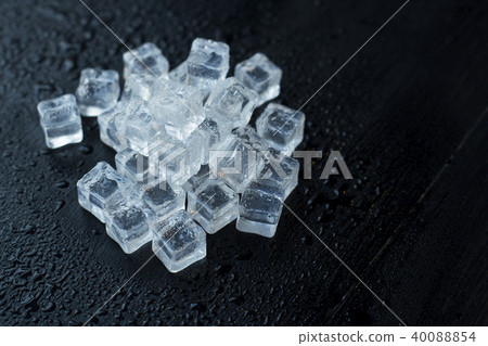 ice cubes reflection on black table background. 40088854