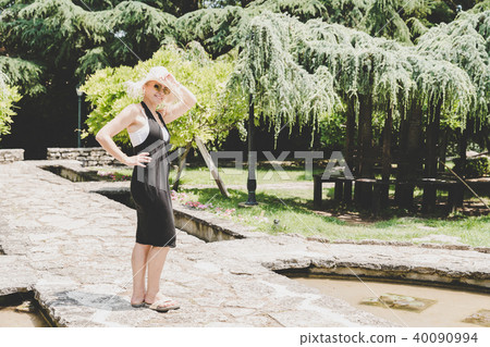 Happy woman in a garden 40090994