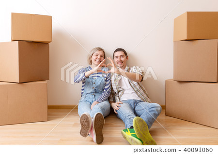 Photo of woman and man sitting on floor Photo of woman and man sitting on floor 40091060