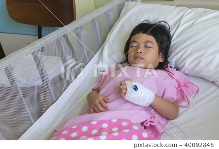Asian little girl sleeping in hospital bed Asian little girl sleeping in hospital bed 40092848