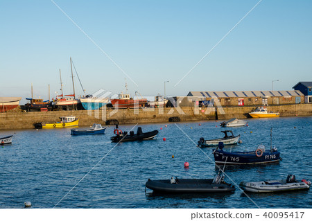 Penzance harbor and boats bathing in the sunset Penzance harbor and boats bathing in the sunset 40095417