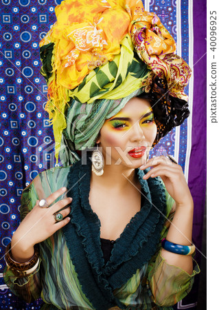 beauty bright woman with creative make up, many shawls on head l 40096925