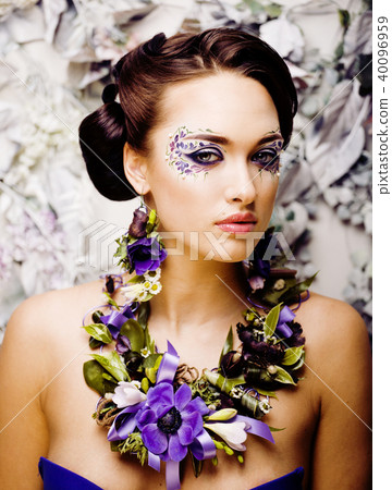 floral face art with anemone in jewelry, sensual young brunette floral face art with anemone in jewelry, sensual young brunette 40096959