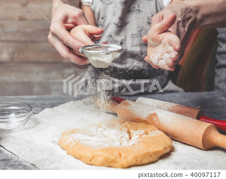 Mothers and children's hands flour dough. Mothers and children's hands flour dough. 40097117