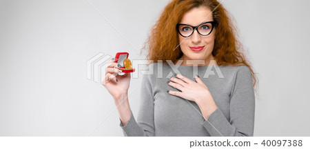 Excited woman with gift box Excited woman with gift box 40097388
