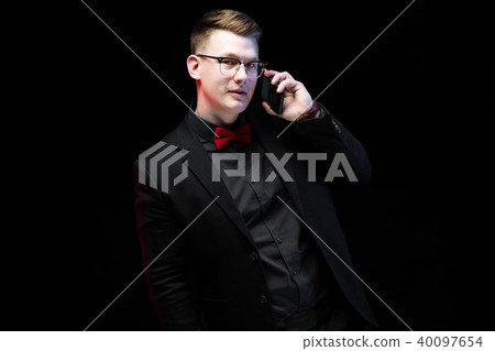 Portrait of confident handsome ambitious happy elegant responsible businessman talking on phone on 40097654