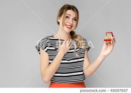 Excited woman with gift box Excited woman with gift box 40097697