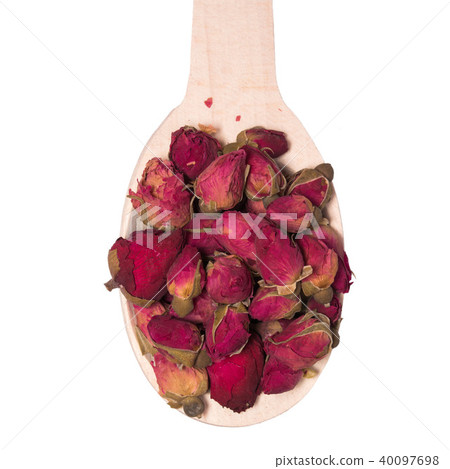 Tea of dry buds of roses in a wooden spoon isolated on white background. Tea of dry buds of roses in a wooden spoon isolated on white background. 40097698
