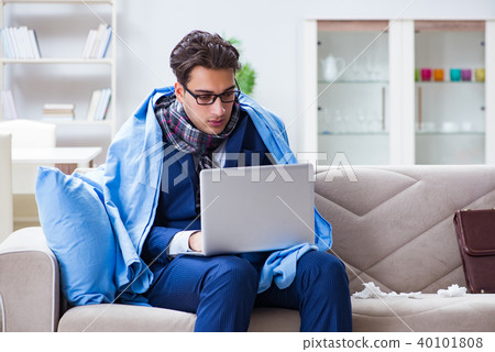 Sick businessman working from home due to flu sickness Sick businessman working from home due to flu sickness 40101808