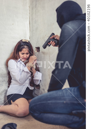 Ransom shooter aiming his gun at the hostage 40102196