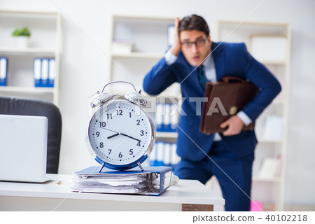 Businessman in bad time management concept 40102218
