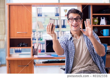 Student studying at home preparing for exam 40102338