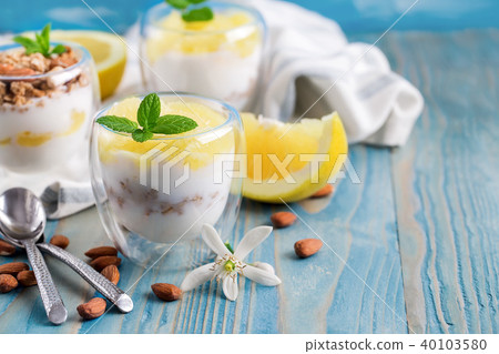 Yogurt with granola and grapefruit background 40103580