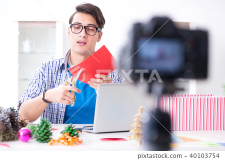 Video blogger recording making paper decoration Video blogger recording making paper decoration 40103754