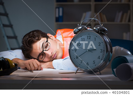 Sleeping architect after late long hours  40104801