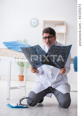 Doctor sitting on the floor in hospital 40105073