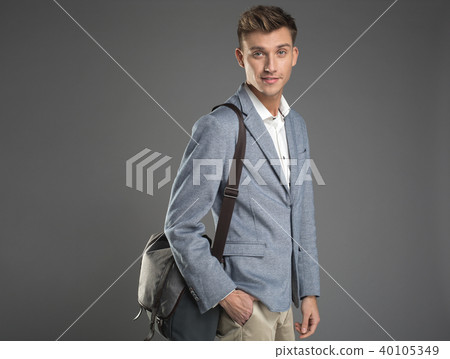 Happy undergrad standing with bag Happy undergrad standing with bag 40105349