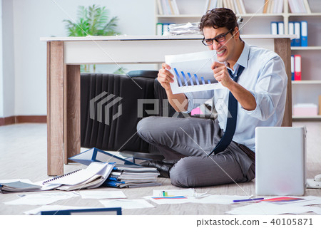 Bankrupt businessman angry in the office floor Bankrupt businessman angry in the office floor 40105871